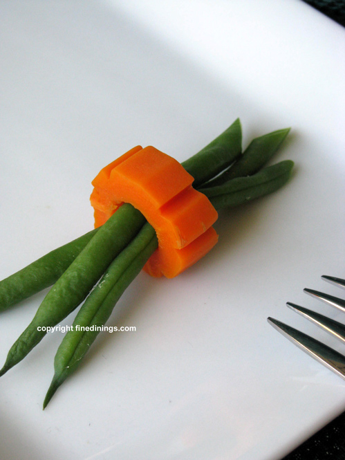 green beans wrapped in a carrot ring