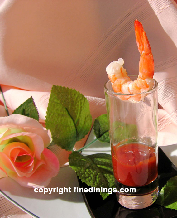 Amuse Bouche Shrimp with cocktail sauce in a shot glass